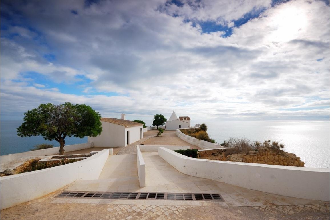The hermitage of Nossa Senhora da Rocha on its promontory at Porches